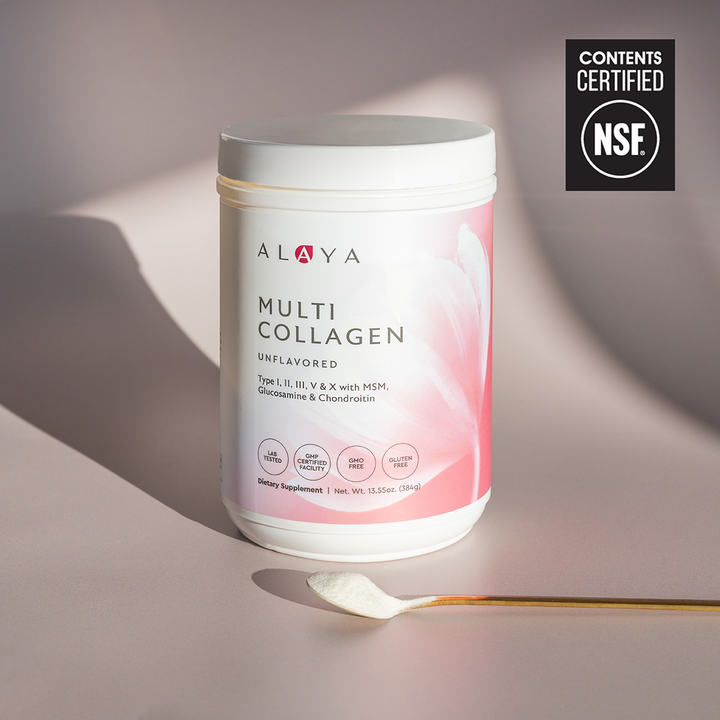 Alaya Multi Collagen Unflavored Powder supplement bottle on a dusty pink background with a gold spoon and powder  #flavor_unflavored